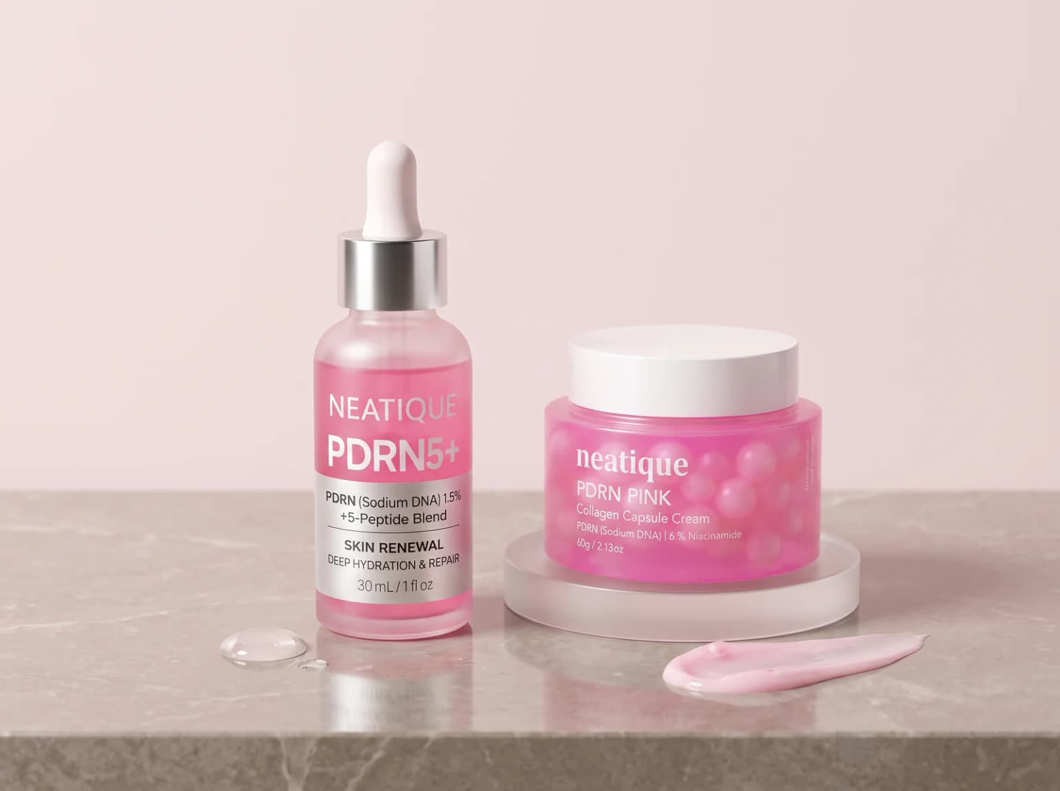 Neatique PDRN serum and PDRN cream arranged with hydrating textures on a blush stone vanity.