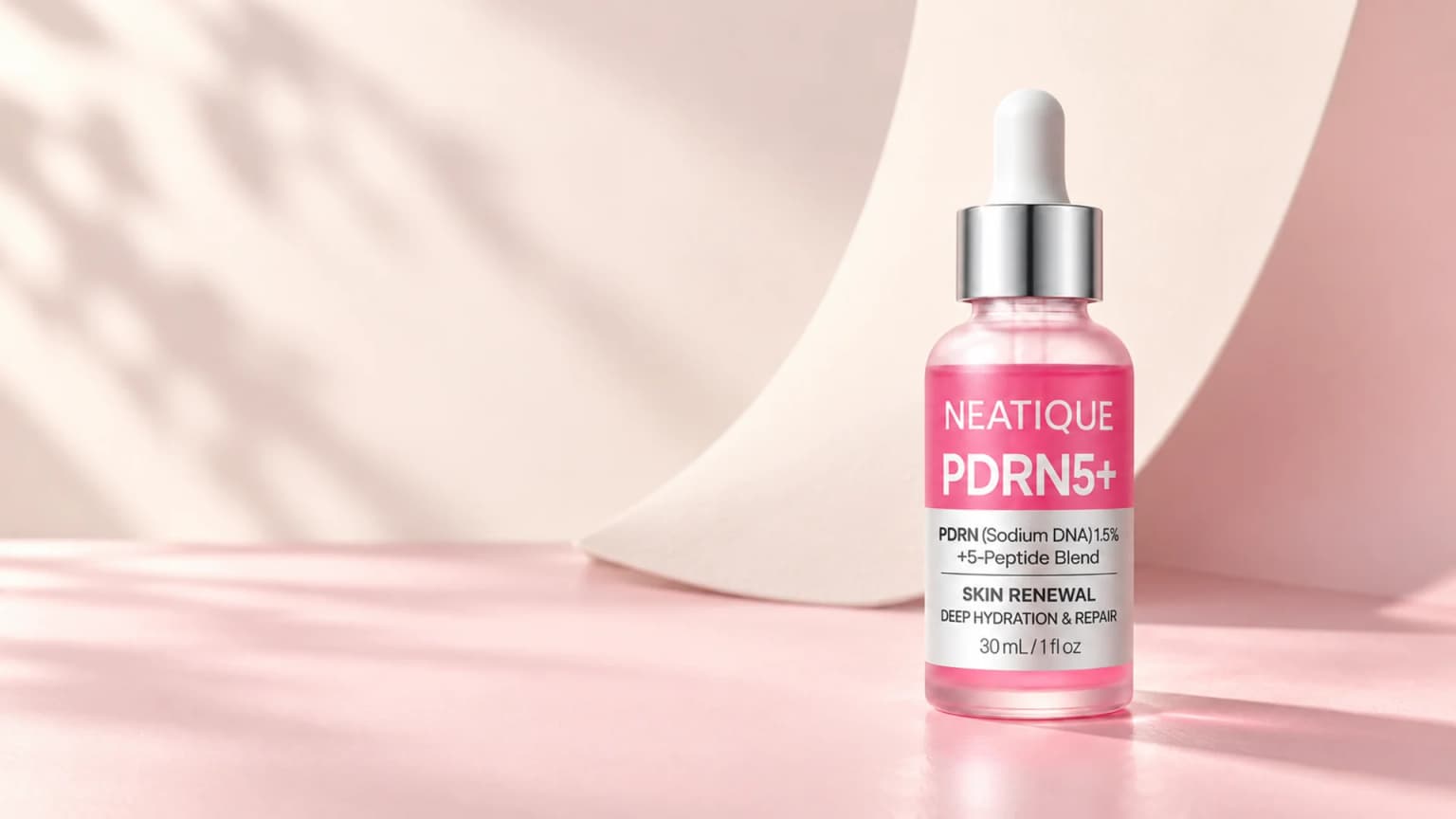 The unchanged original PDRN Serum packaging in a quiet Q-Seal studio with sculptural ivory light.