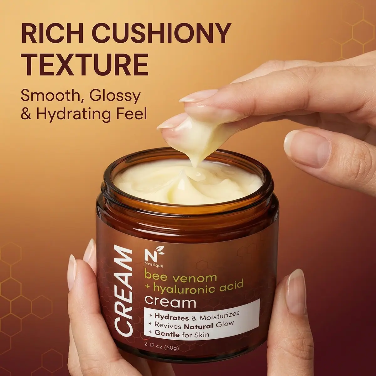 Rich cushiony texture of Neatique Bee Venom Body Cream being lifted from the jar